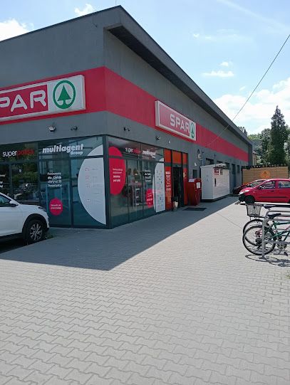 Spar, магазин біля вокзалу Домброва Гурніча Зомбковіце